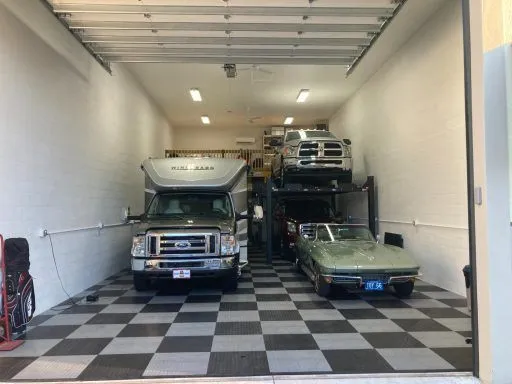 Garage condo with RV, car lift and classic car