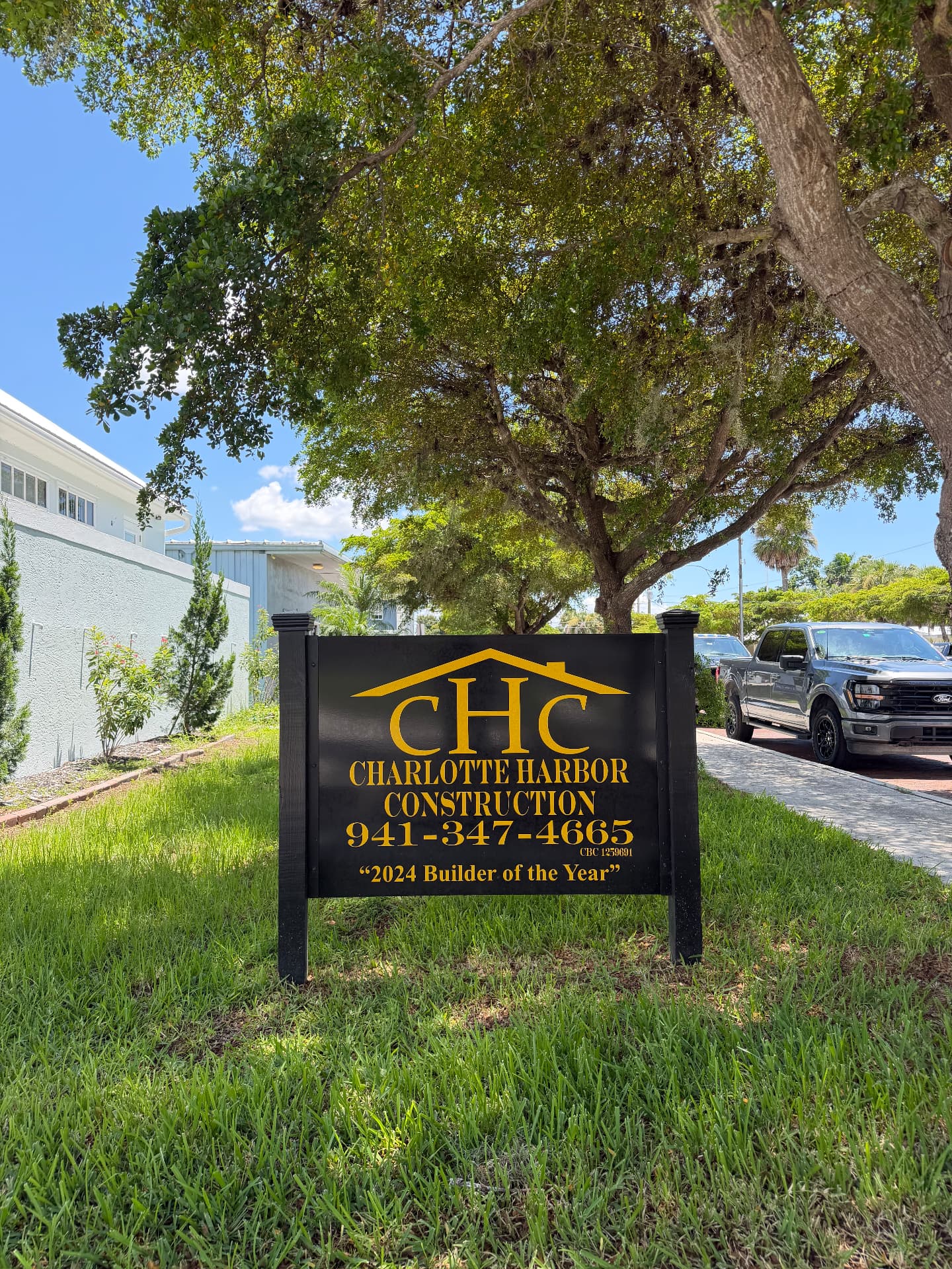 Charlotte Harbor Construction sign with 2024 Builder of the Year award