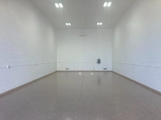 Finished garage condo bay with tan epoxy floor